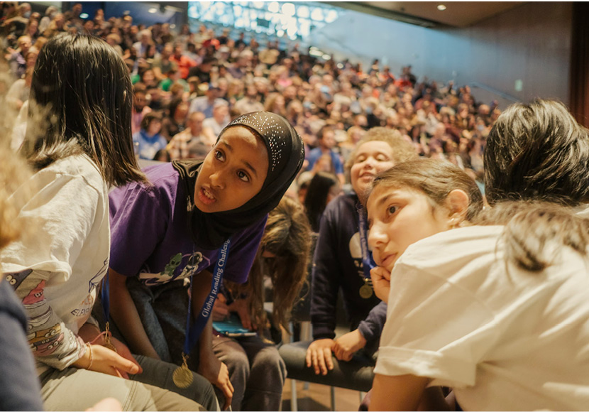 People in an auditorium.